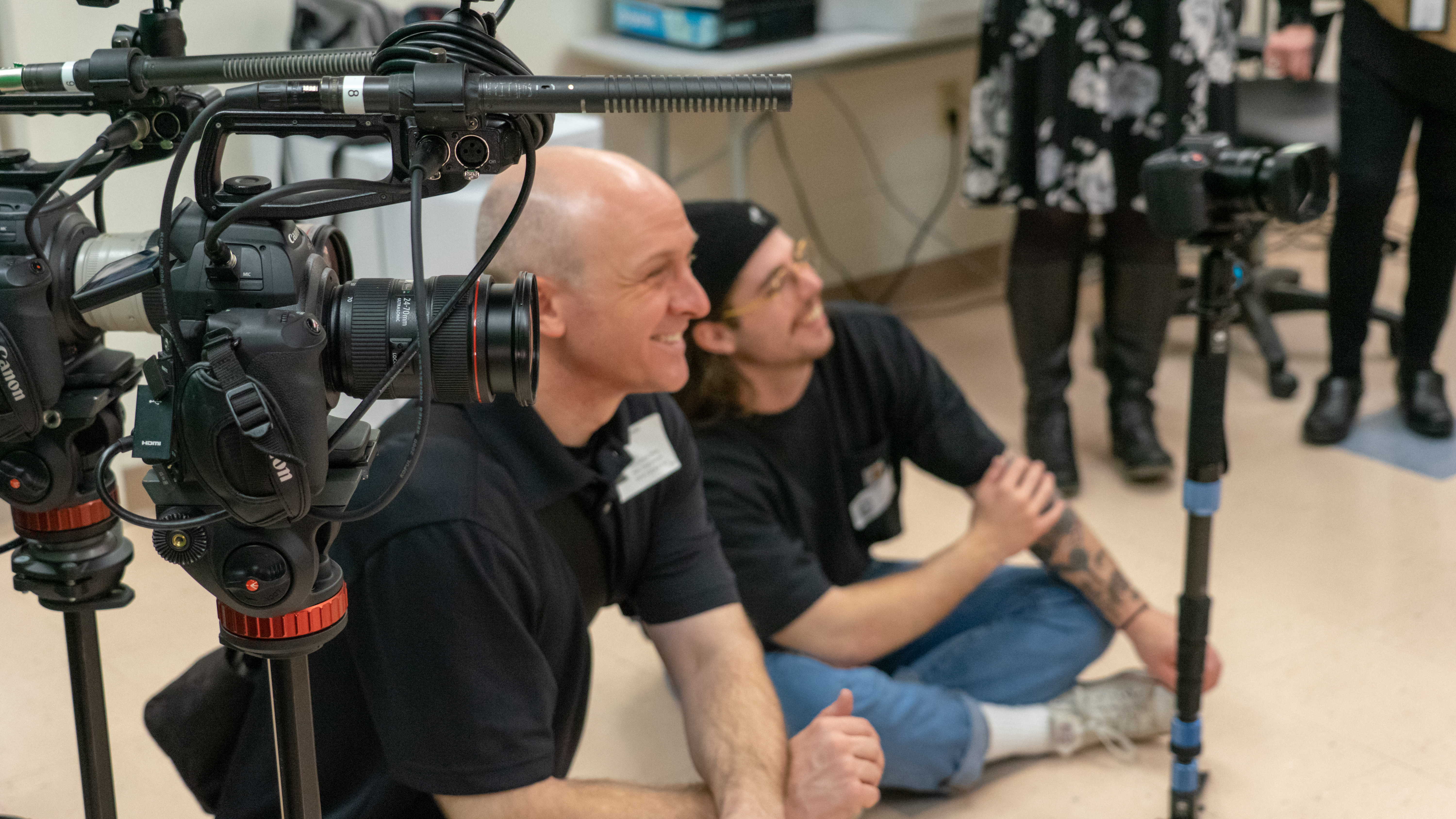  Paul Wasneski and Peter Straehl need to juggle multiple aspects of video production when filming, including monitoring cameras and simultaneously conducting interviews. 
