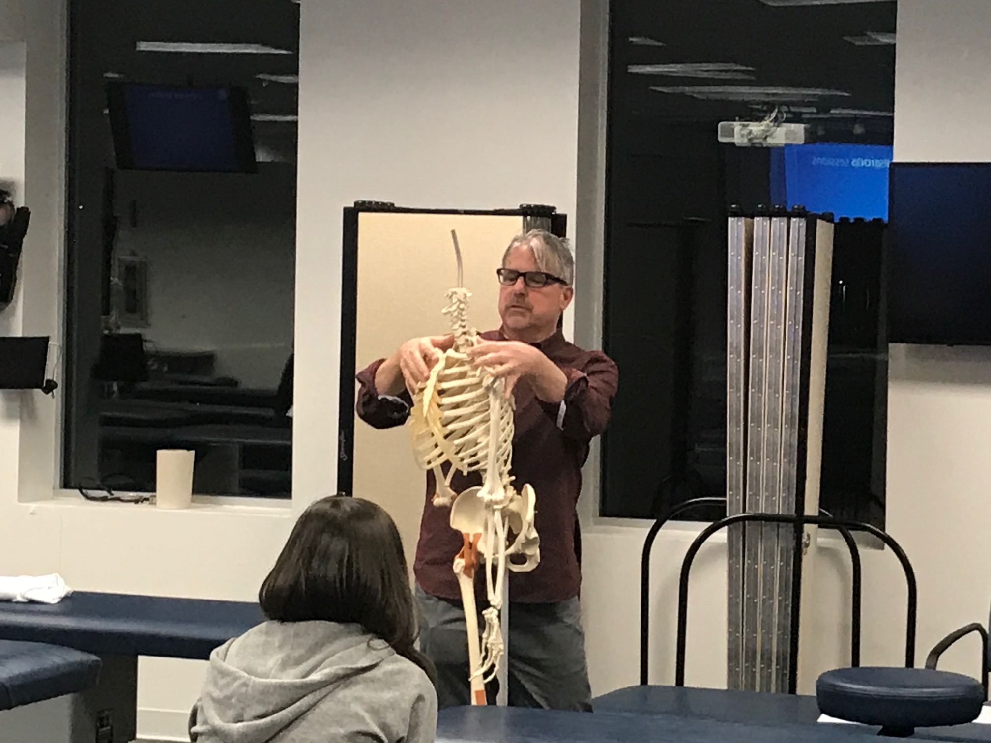 Dr. John Capobianco D.O., FAAO demonstrating landmarks and hand placement for Osteopathic Manipulative approaches