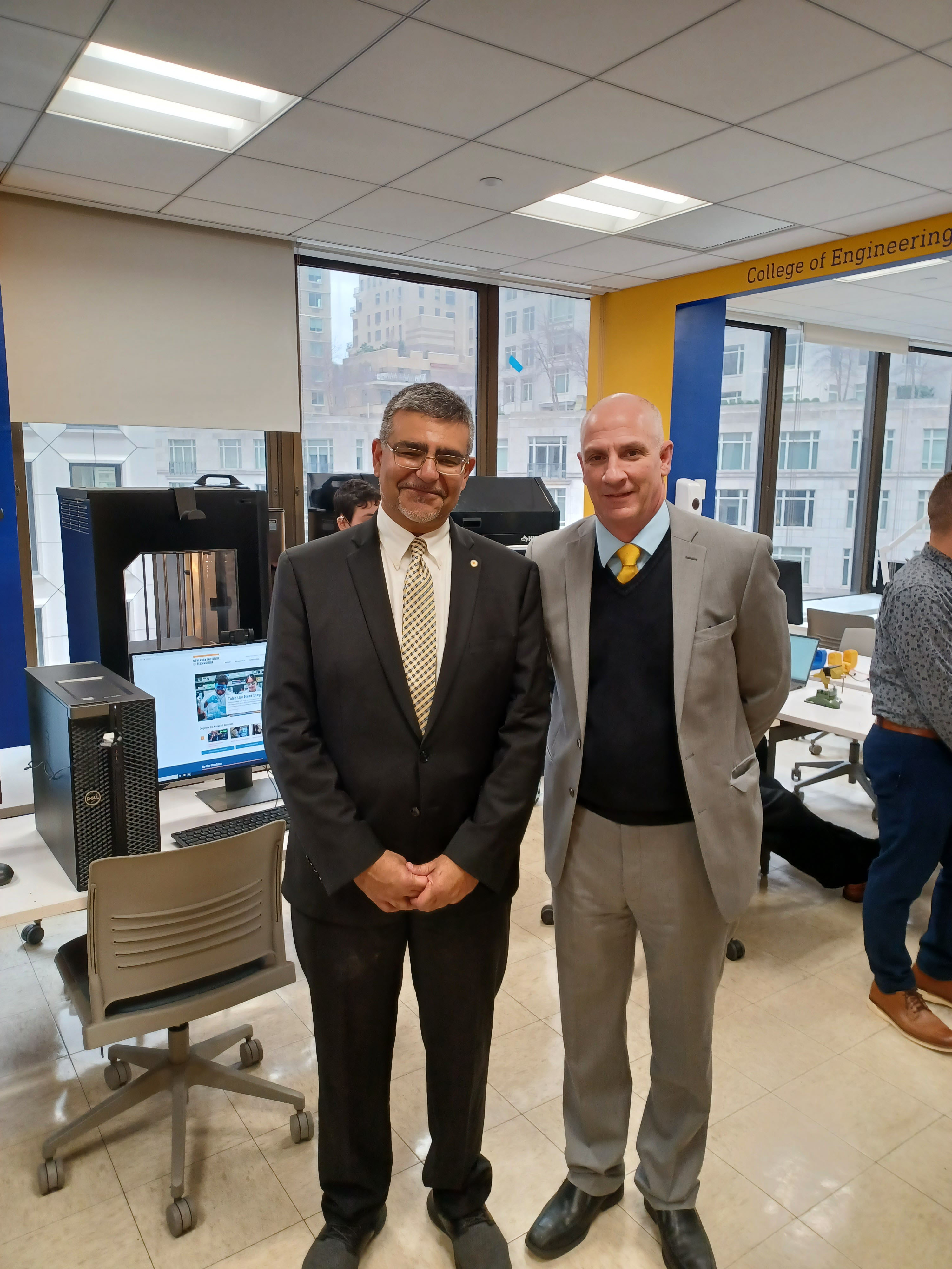Dean Babak Dastgheib-Beheshti and Michael Nizich, director of the ETIC (respectively)