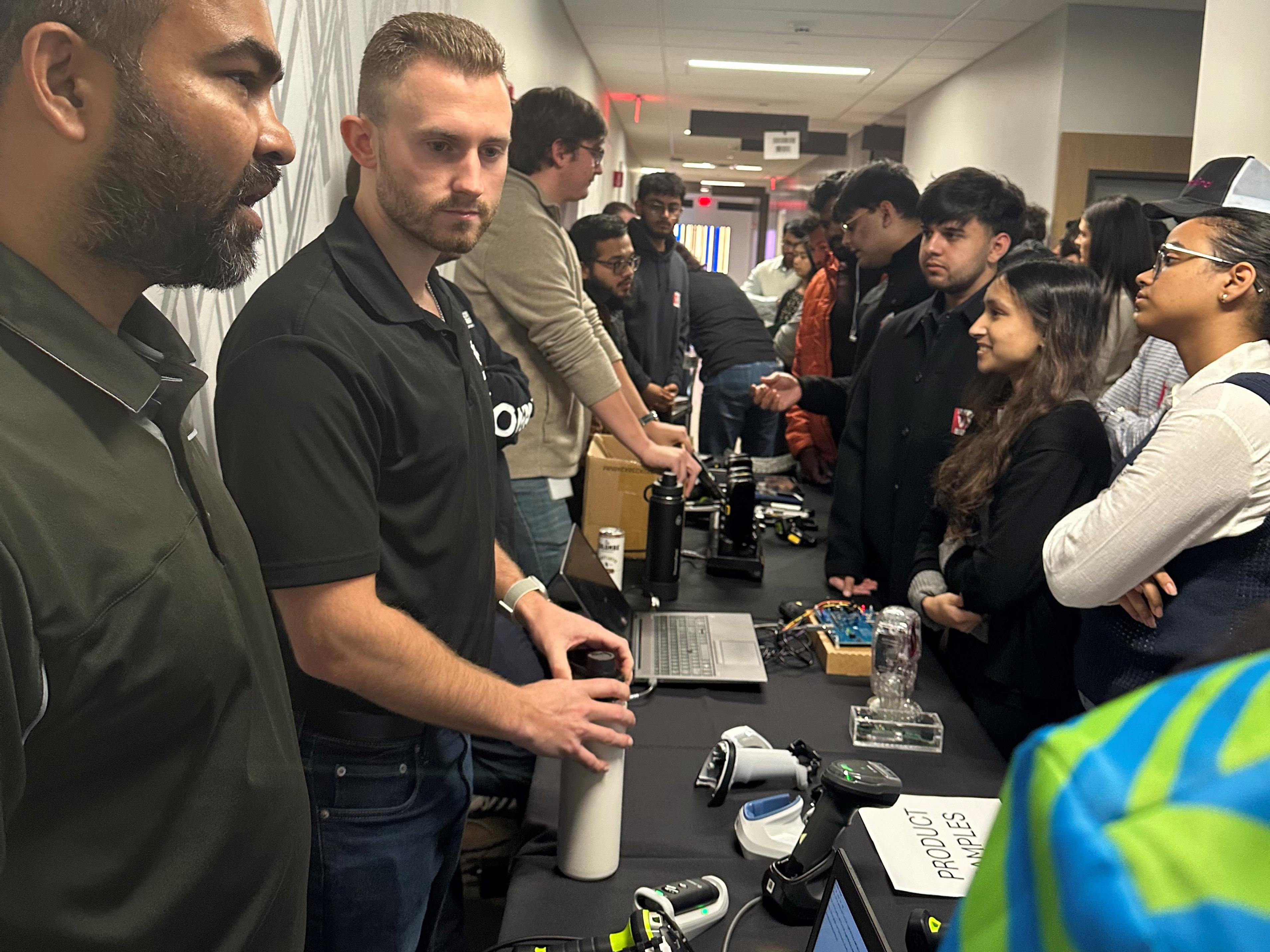 Zebra engineers demonstrate various use cases for their handheld scanners, showcasing their versatility in different industries.