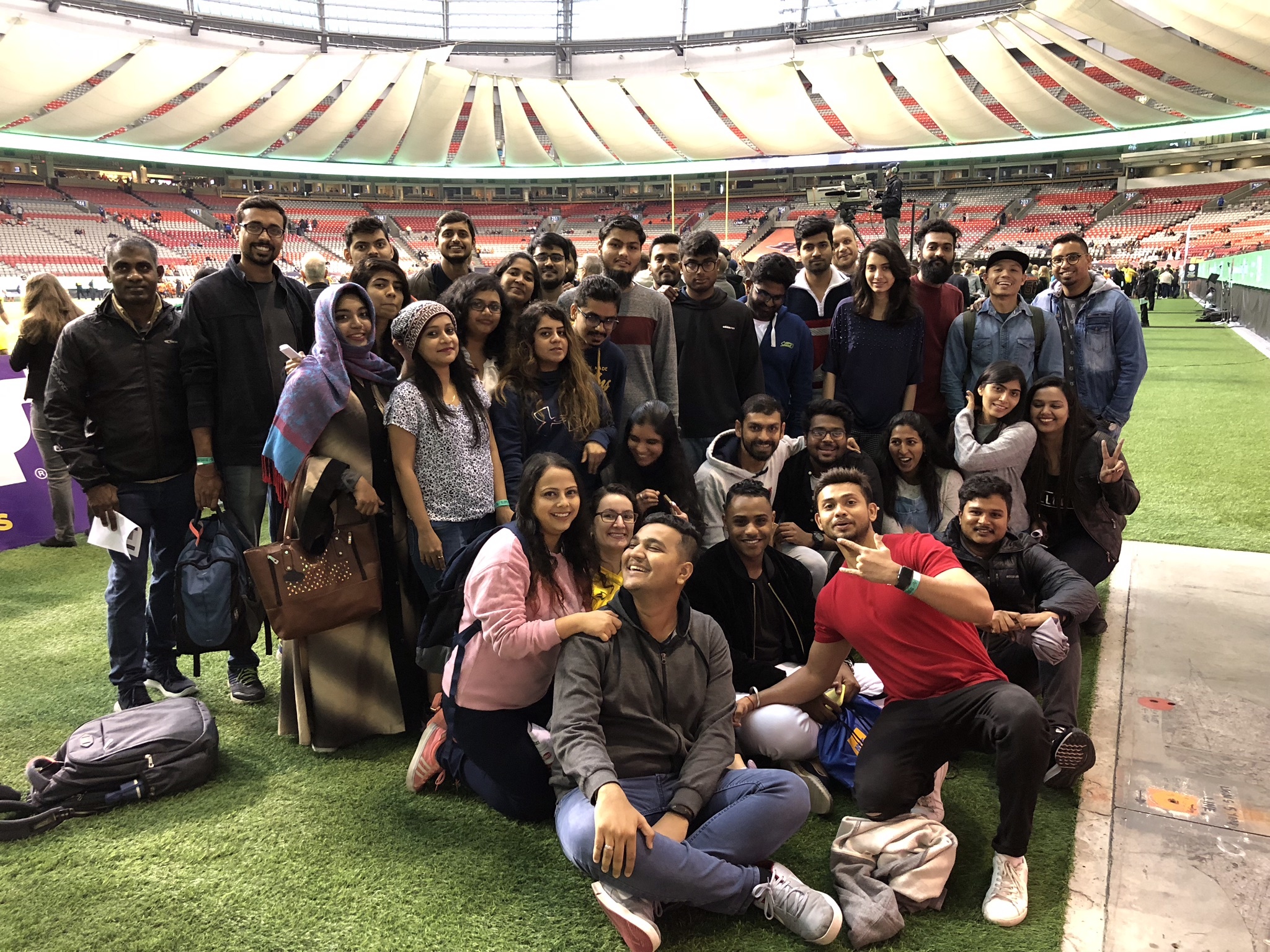 Group picture before the game at field level.