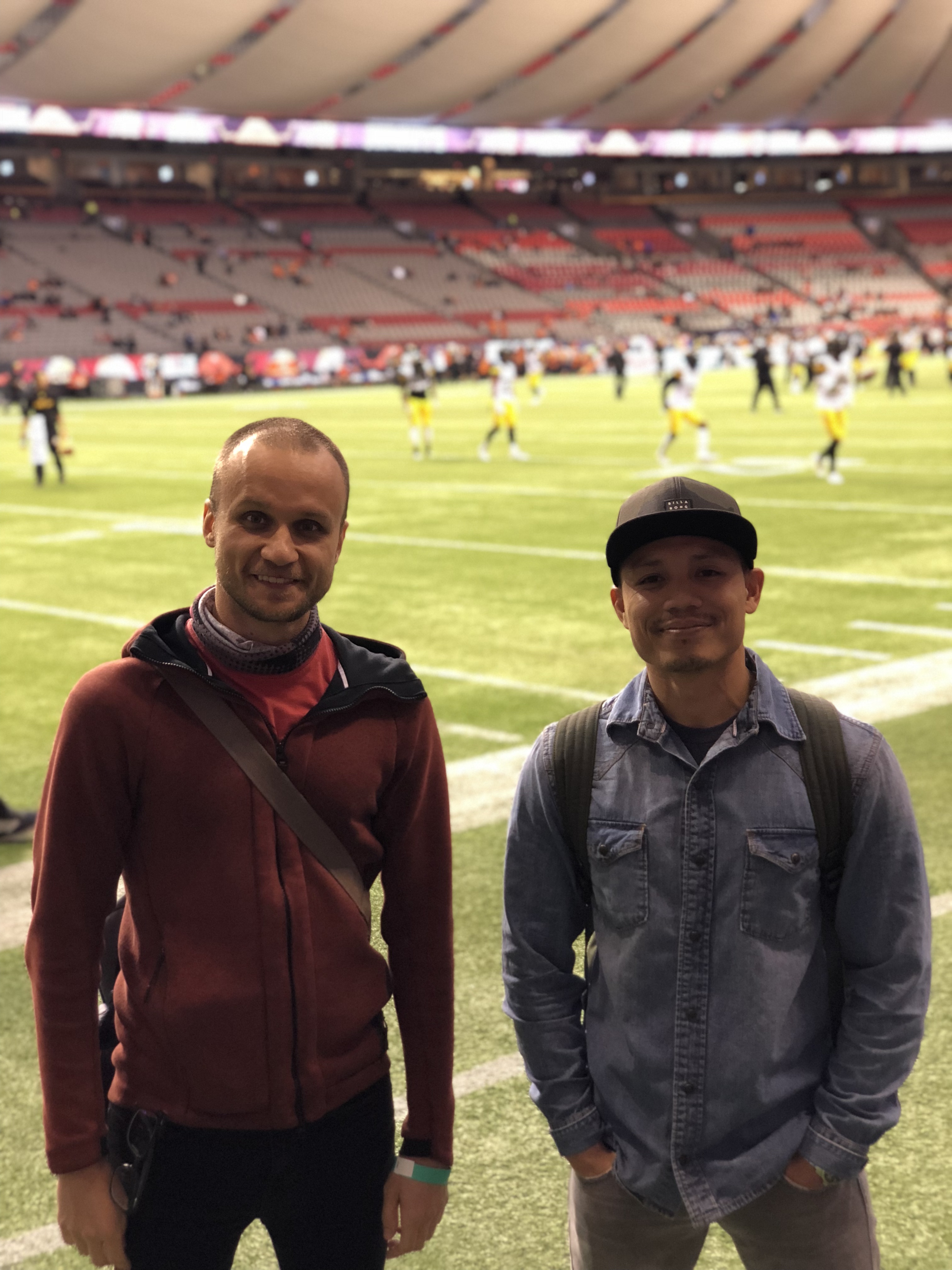 Two students in front of the field.